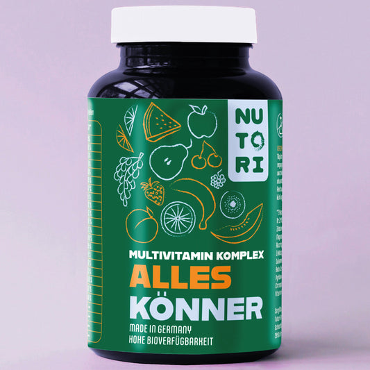 A realistic close‑up of natural supplement ingredients like leafy greens, berries, and mineral crystals spread on a wood